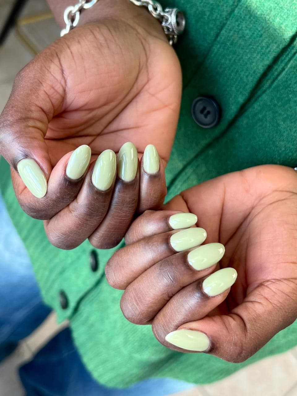 Oval gel manicure in glossy pistachio green polish at My Beauty Space in Mississauga