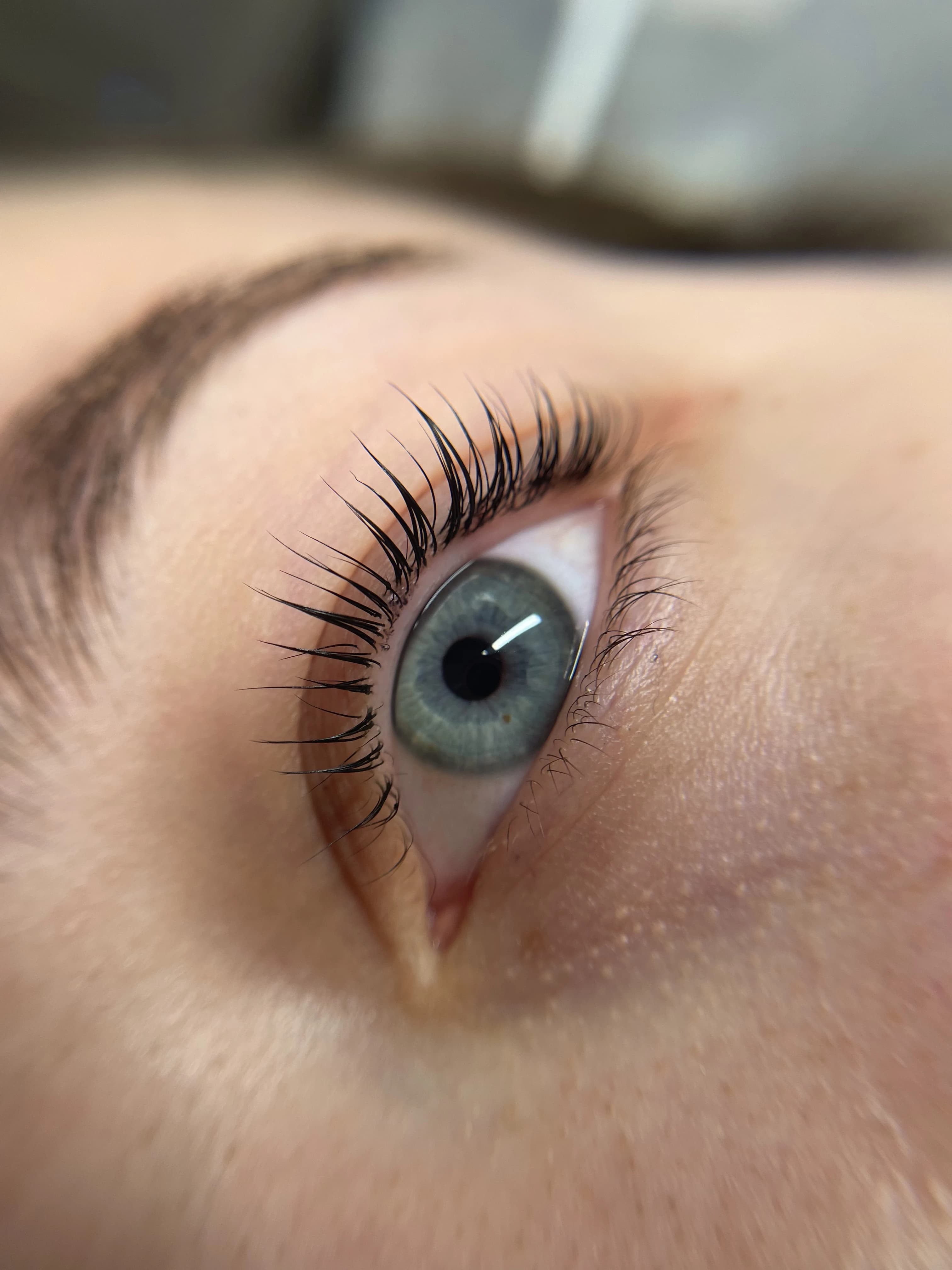 High-angle lash lift and tint with glossy black curl on blue-grey eyes at My Beauty Space Mississauga.