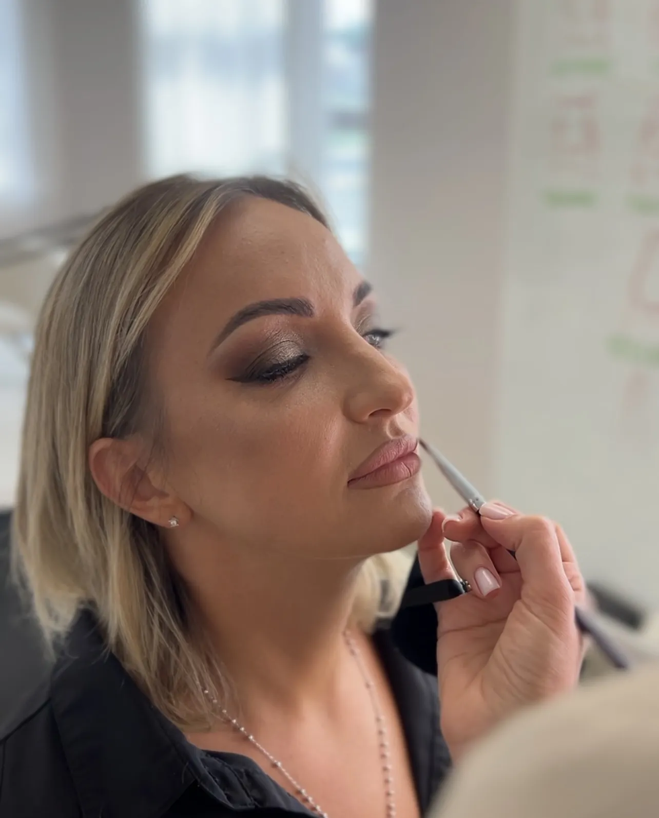 Smokey eye and winged liner with nude-pink lips refined by an artist during glam makeup at My Beauty Space Mississauga.