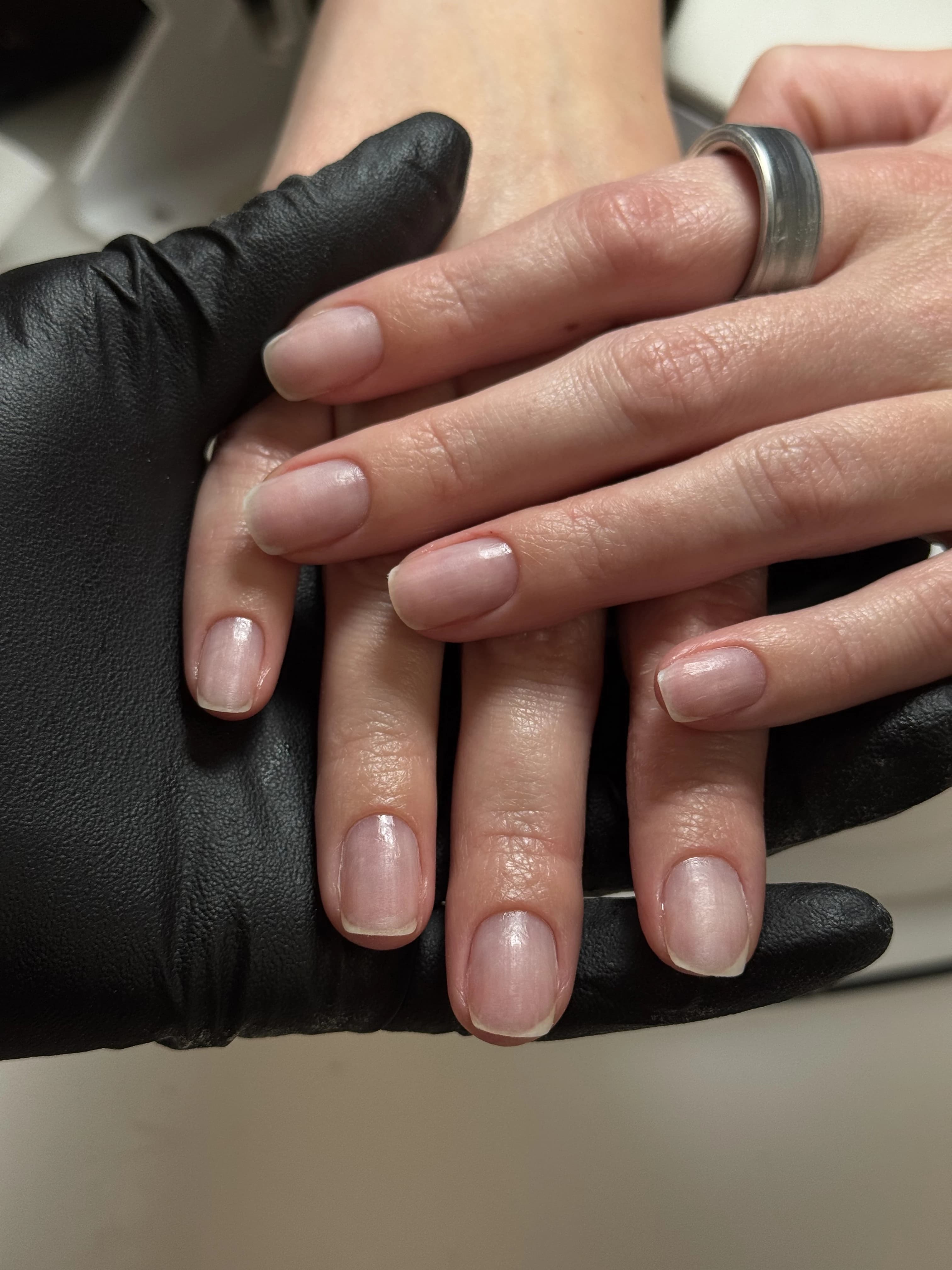 Neat squoval natural nails without color polish, supported by a technician at My Beauty Space no-polish manicure Mississauga.